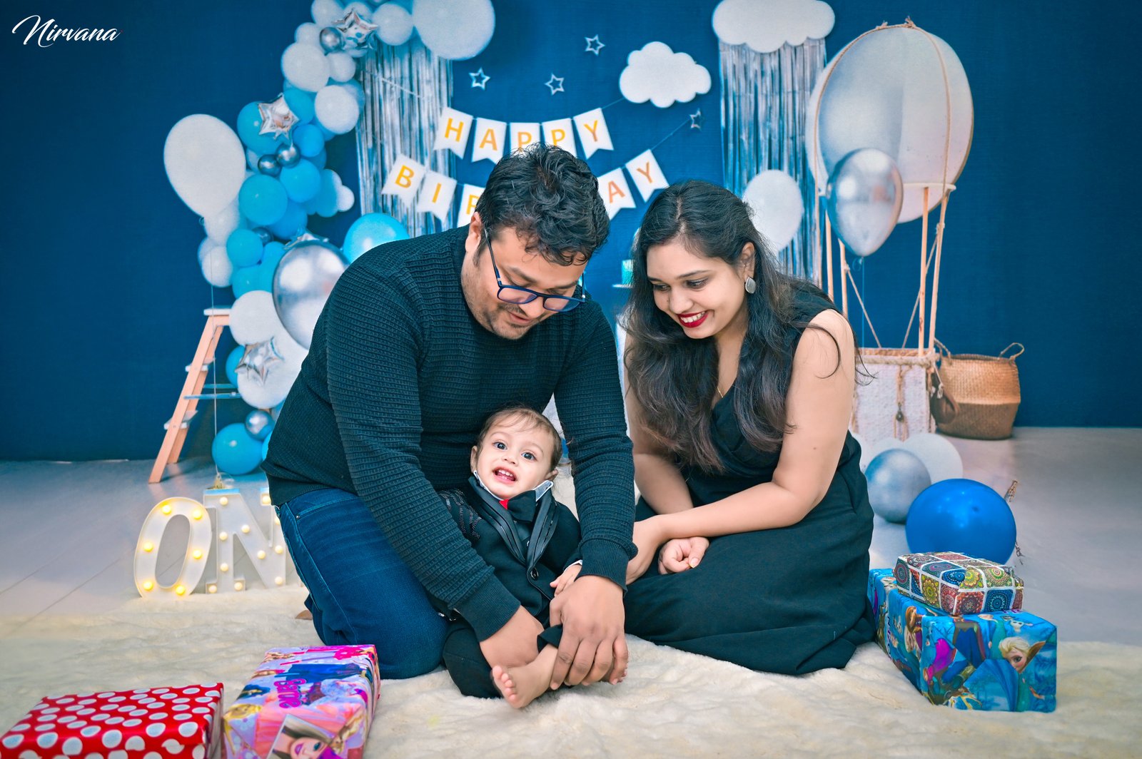 Warm family portrait with baby by Nirvana Photography, image 1