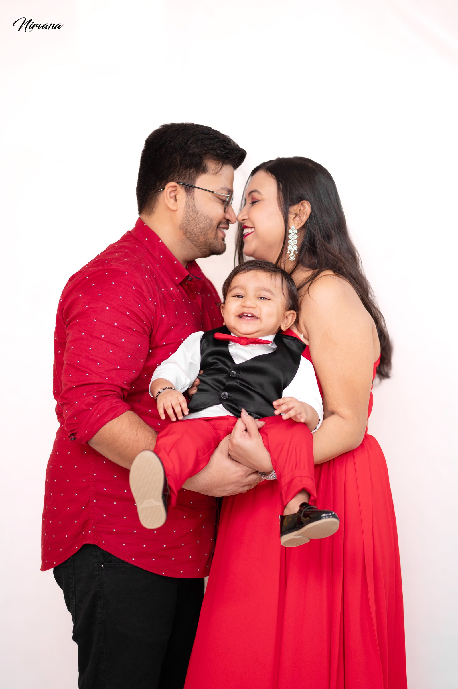 Warm family portrait with baby by Nirvana Photography, image 3