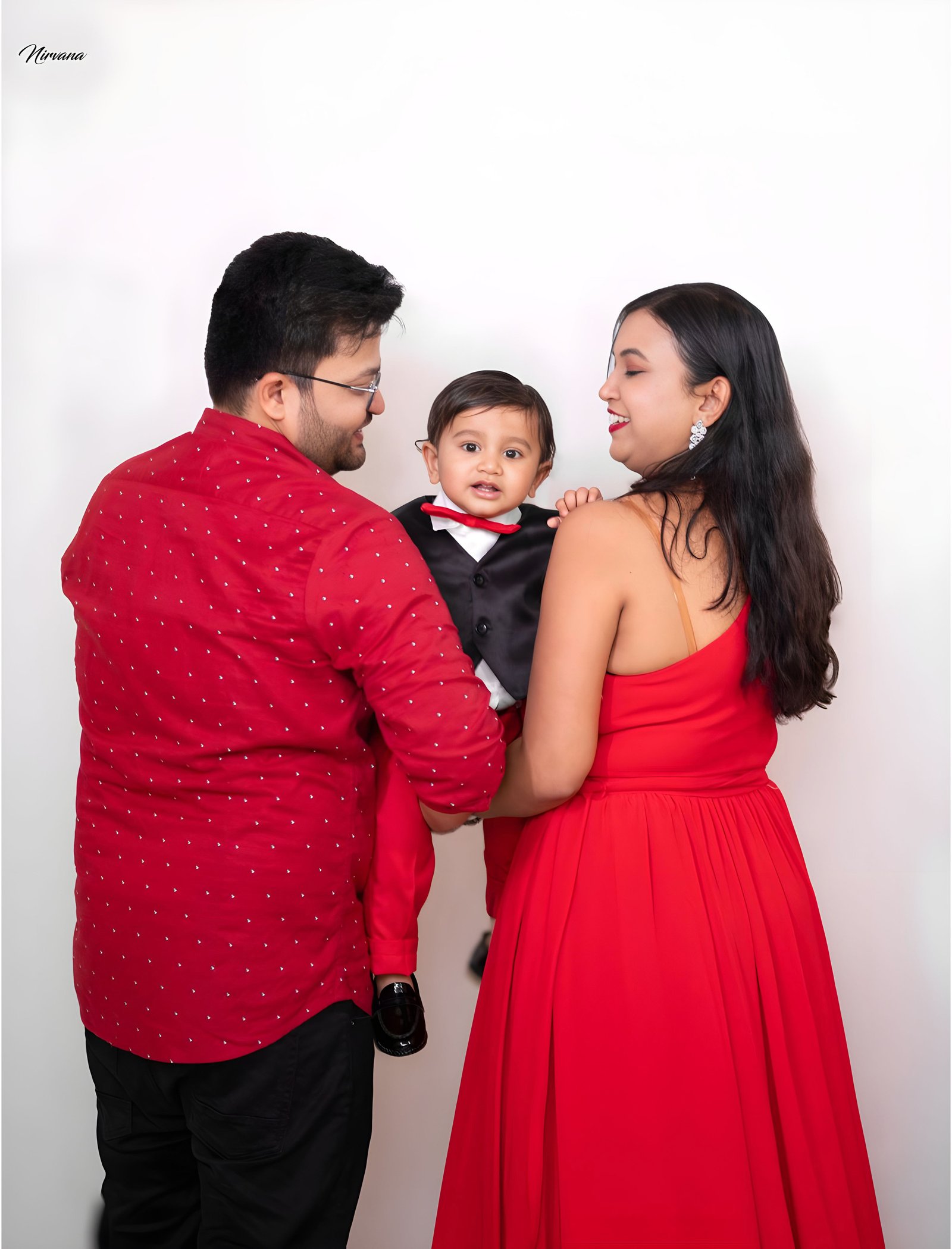 Warm family portrait with baby by Nirvana Photography, image 4