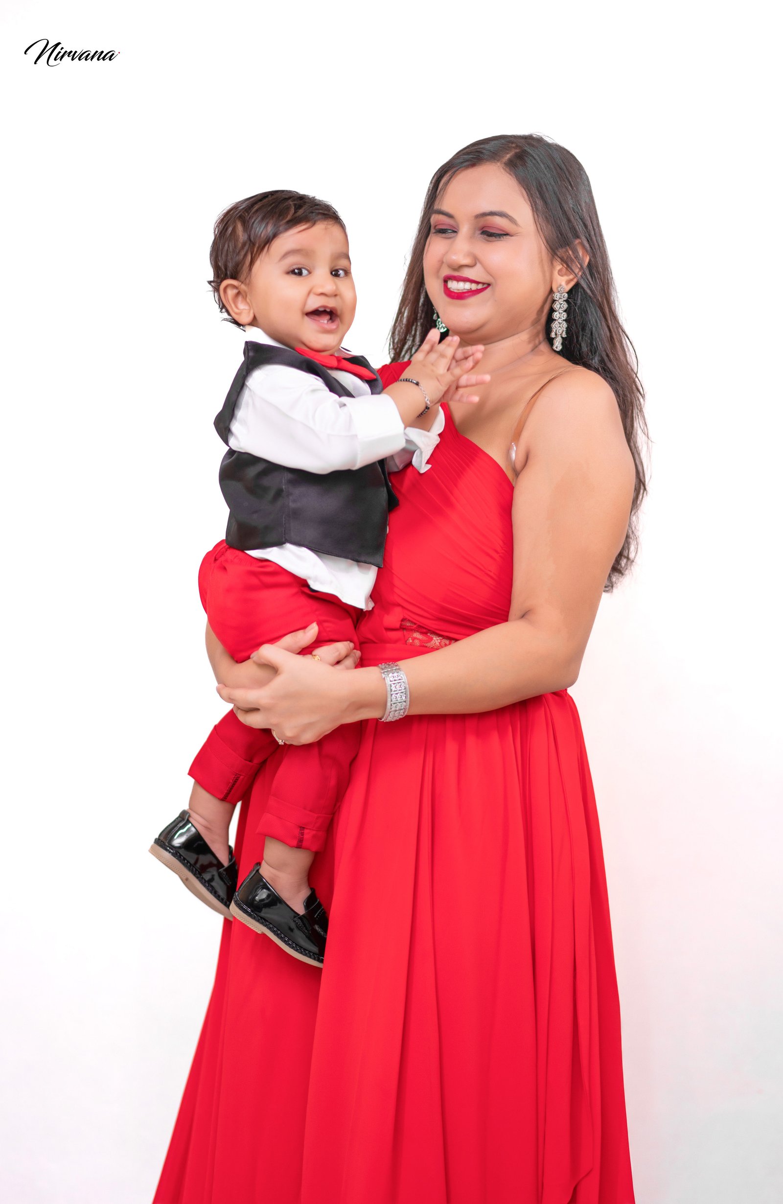 Warm family portrait with baby by Nirvana Photography, image 6