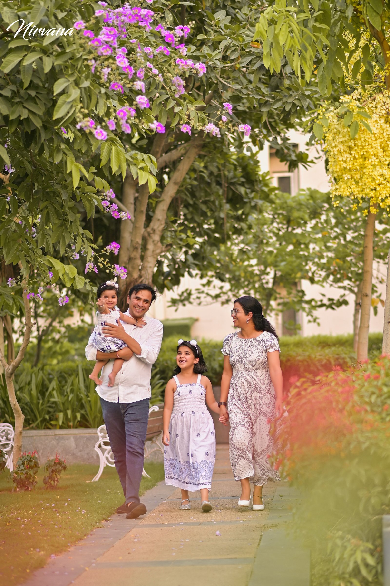 Warm family portrait with baby by Nirvana Photography, image 9