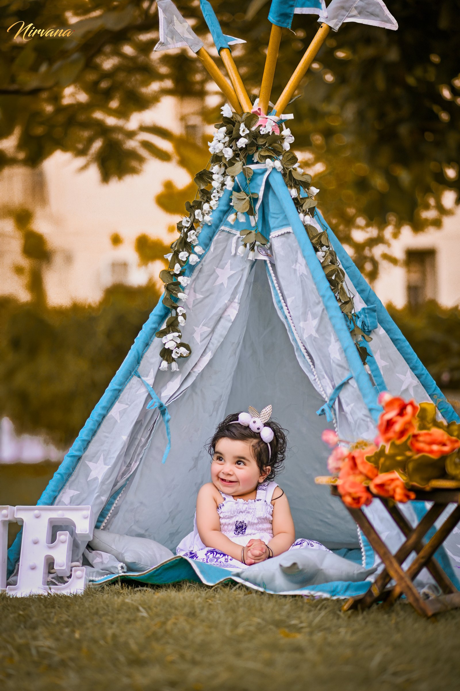 Warm family portrait with baby by Nirvana Photography, image 12