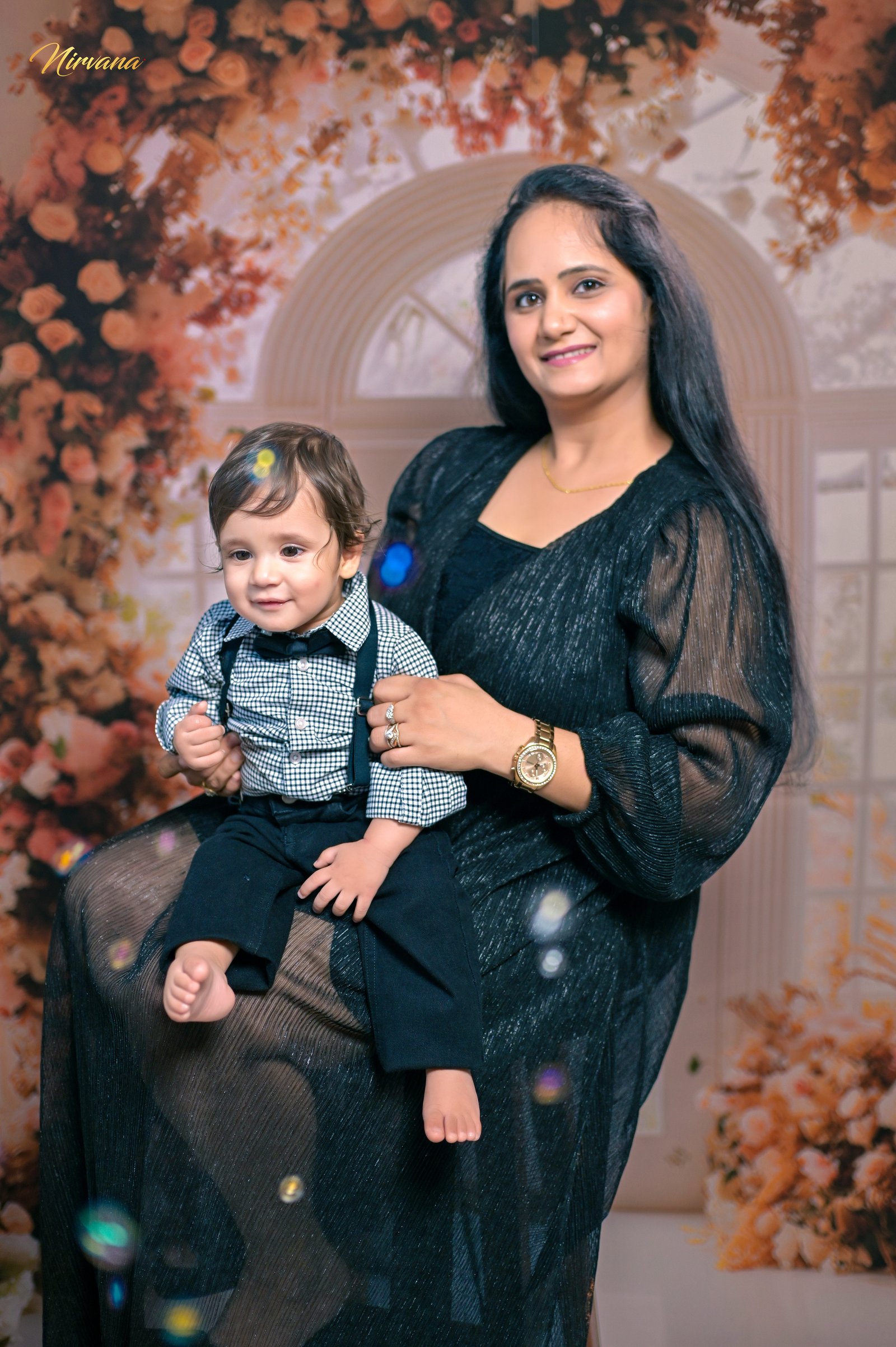 Warm family portrait with baby by Nirvana Photography, image 13