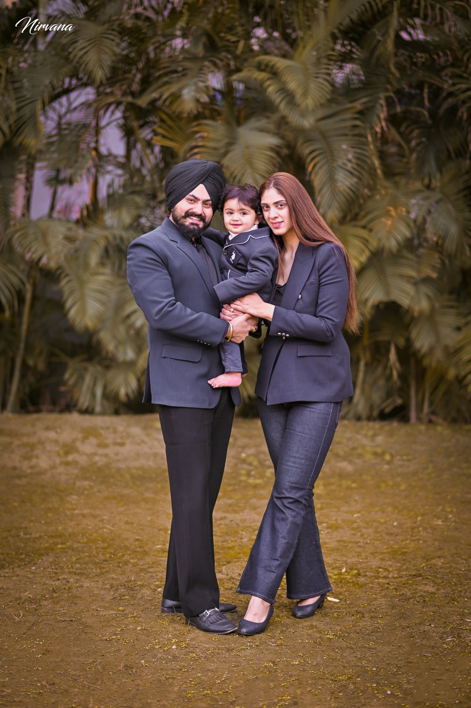 Warm family portrait with baby by Nirvana Photography, image 16